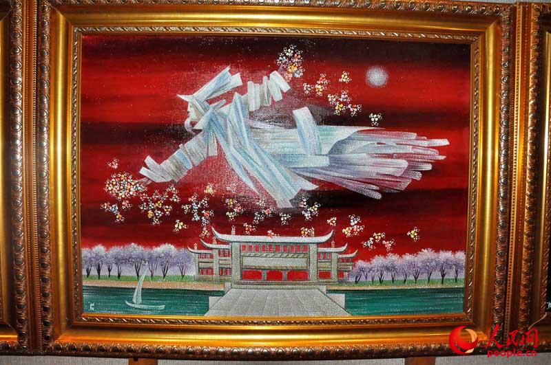 《飞翔的天使》。画中的建筑象征着中国，飞翔的天使护佑着中国及中国人民。（摄影 人民网李政杰）